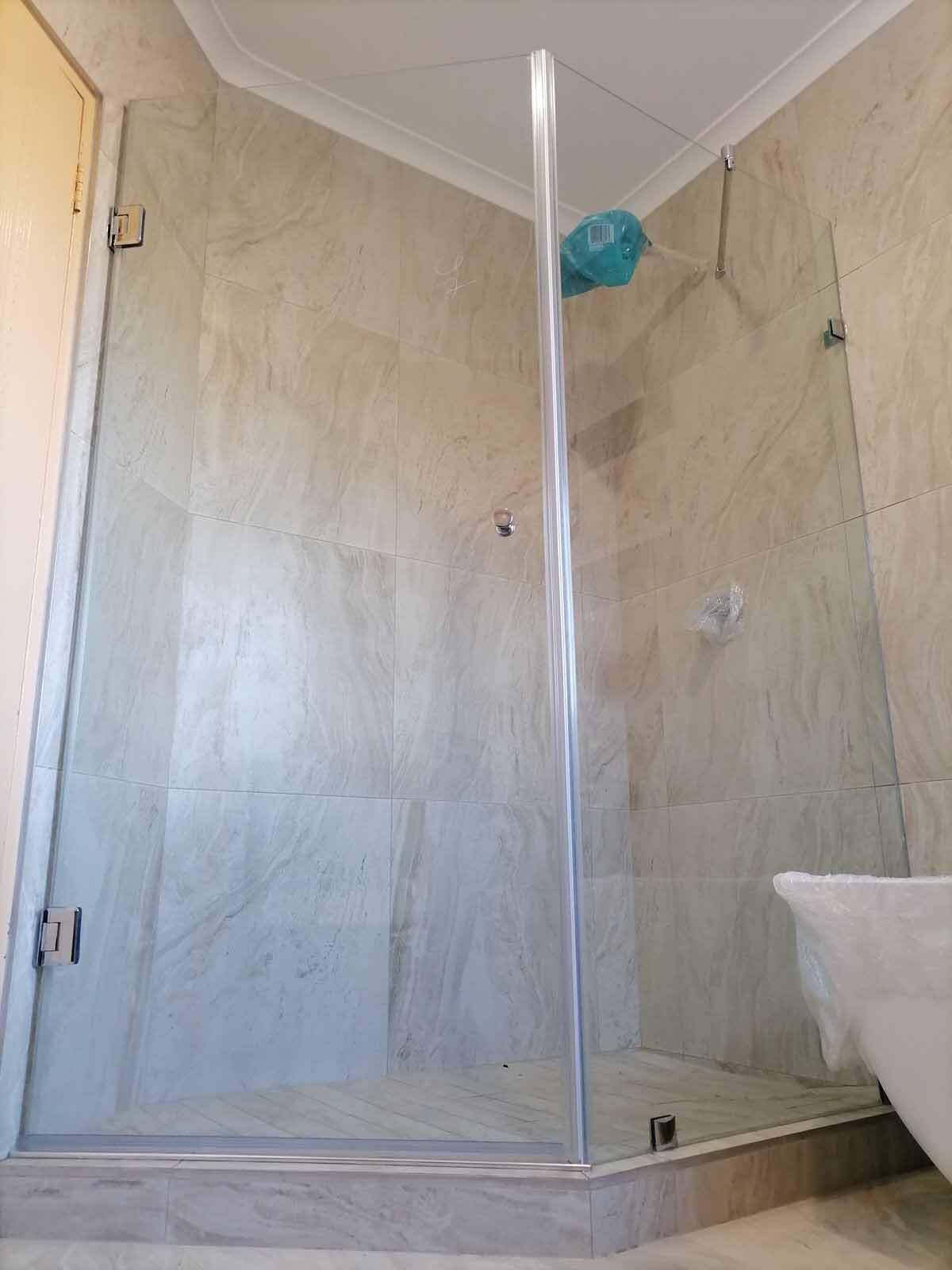 neo-angle custom mamde frameless shower door